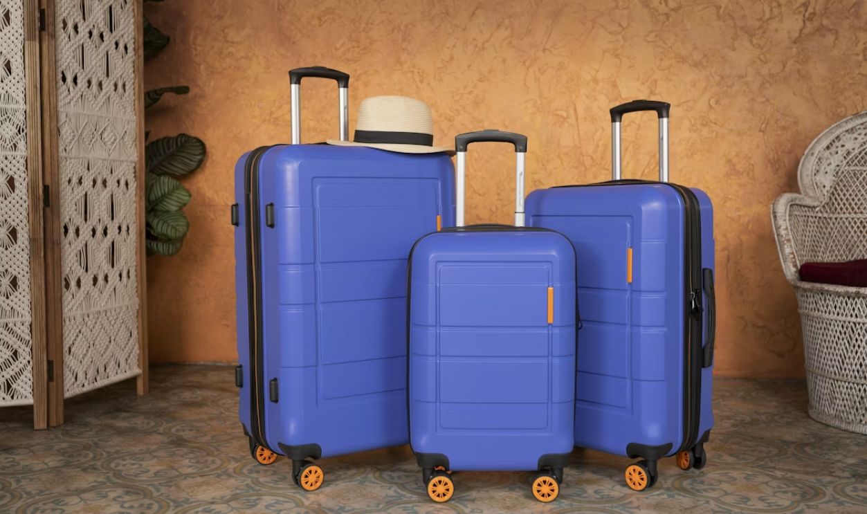 three pieces of blue luggage sitting next to each other