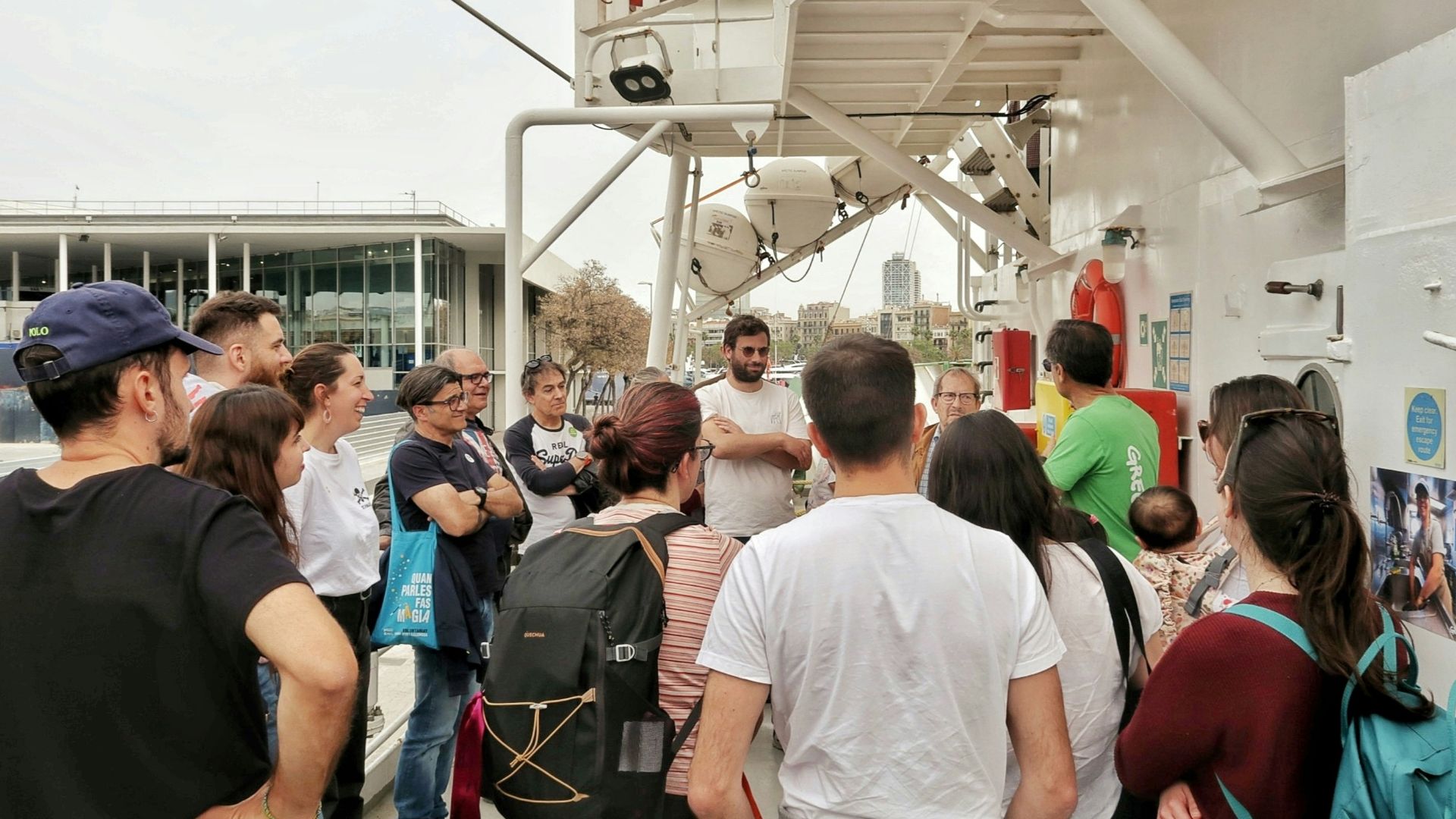 A group of people gathered on a boat deck.