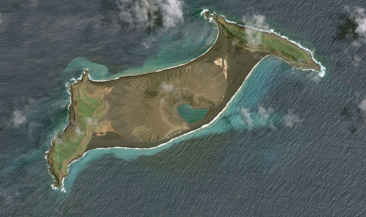 : In this image 1. of a series created on January 19, 2022, Maxar overview satellite imagery shows the Hunga Tonga-Hunga Ha'apai volcano on December 12, 2021, before the eruption on January 14th , 2022 in Hunga Tonga-Hunga Ha'apai Islands, Tonga.