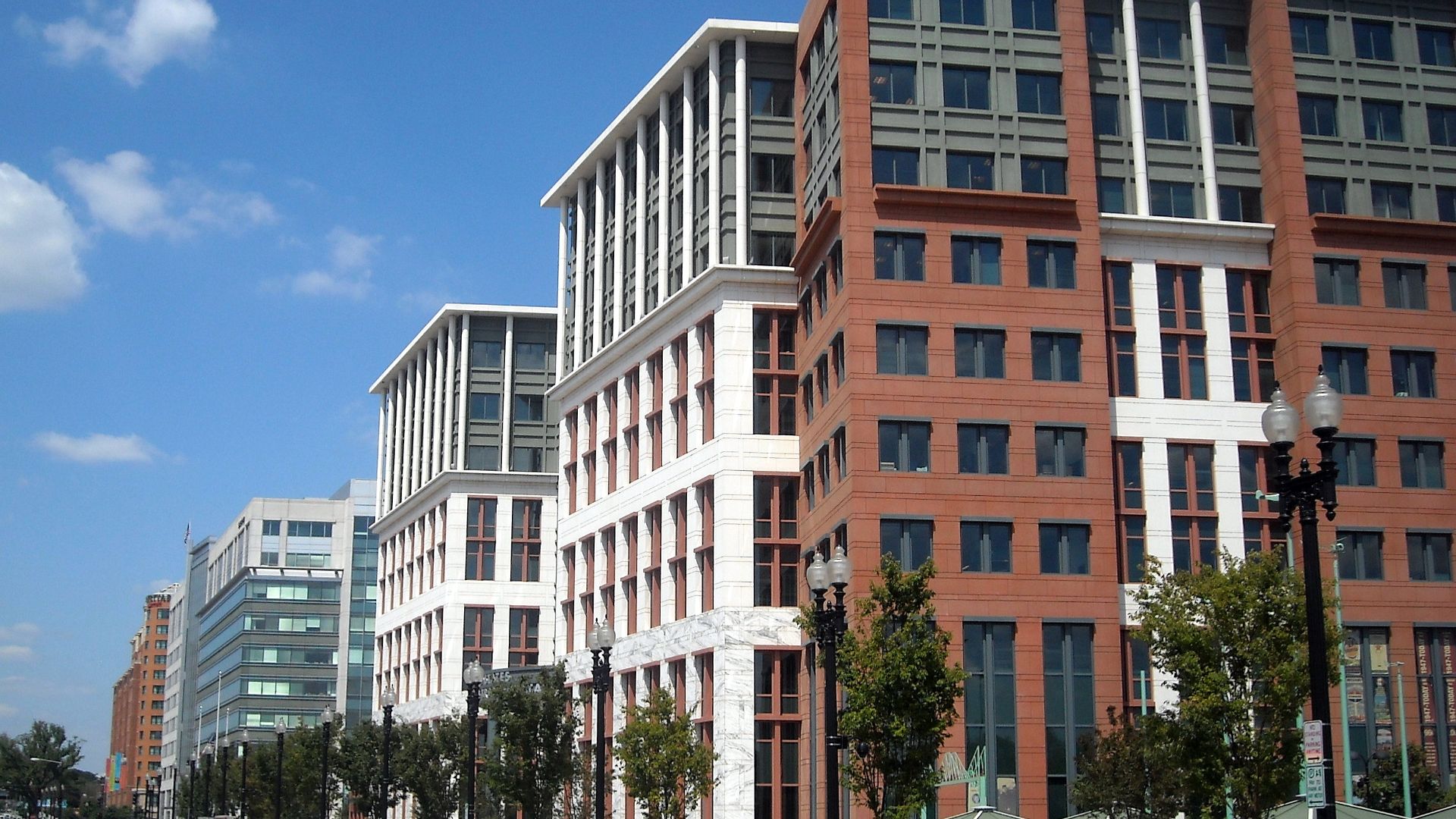 The United States Department of Transportation headquarters, located at 1200 New Jersey Avenue, S.E., in the Navy Yard neighborhood of Washington, D.C.  The dome of the United States Capitol is visible in the background.