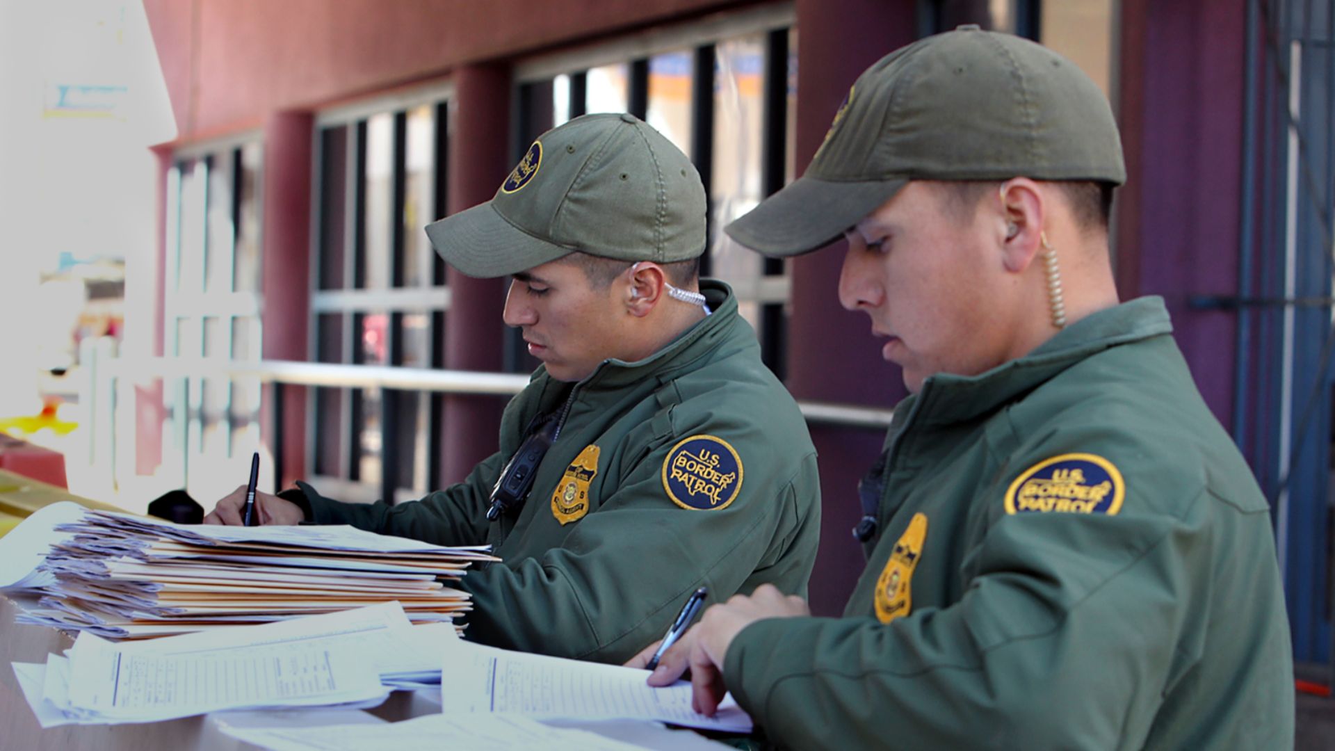 CBP Border Patrol agents complete official paper work after completing bus security at Nogales port of entry, DeConconi.