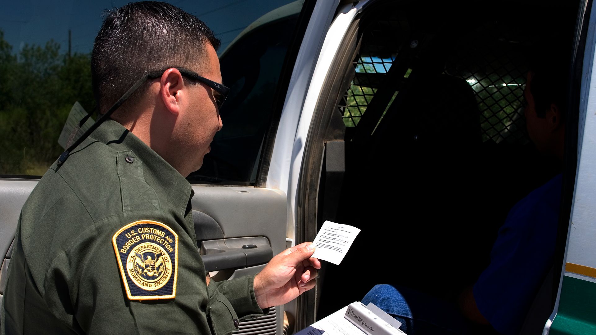 Border Patrol agent reads the Miranda rights to a Mexican national arrested for transporting drugs (U.S. Customs and Border Protection - United States Department of Homeland Security)