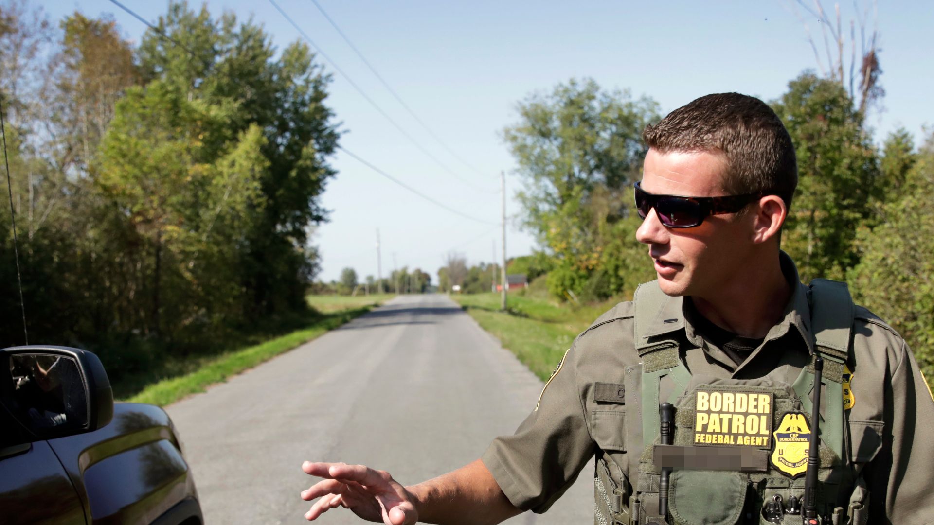A U.S. Border Patrol agent searches a rural neighborhood for illegal migrants near Malone, New York, September 16, 2024. CBP Photo by Glenn Fawcett