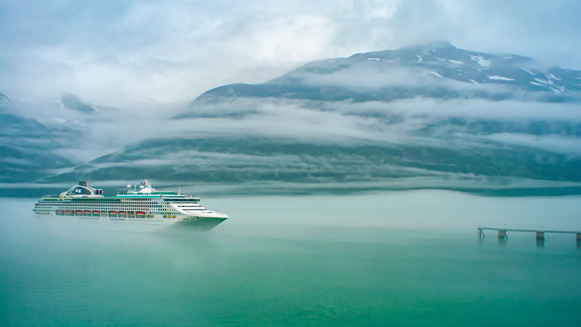 white cruise ship on body of water during daytime