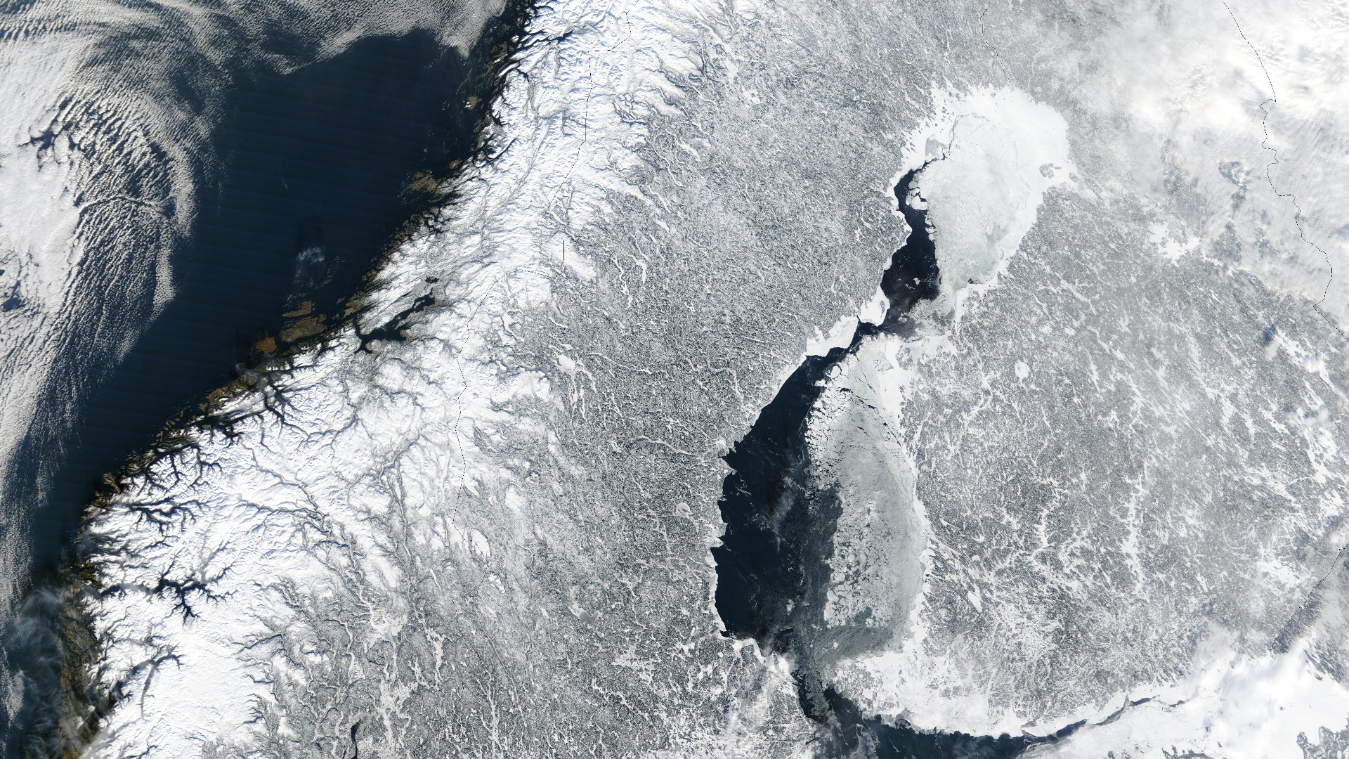 Scandinavia from space in winter.
The Moderate Resolution Imaging Spectroradiometer (MODIS) instrument aboard NASA’s Terra satellite captured the above image of the Scandinavian Peninsula on February 19, 2003.
With a landscape largely shaped by glaciers o