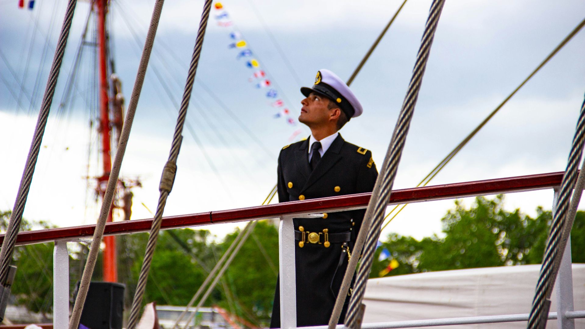 man standing on boat