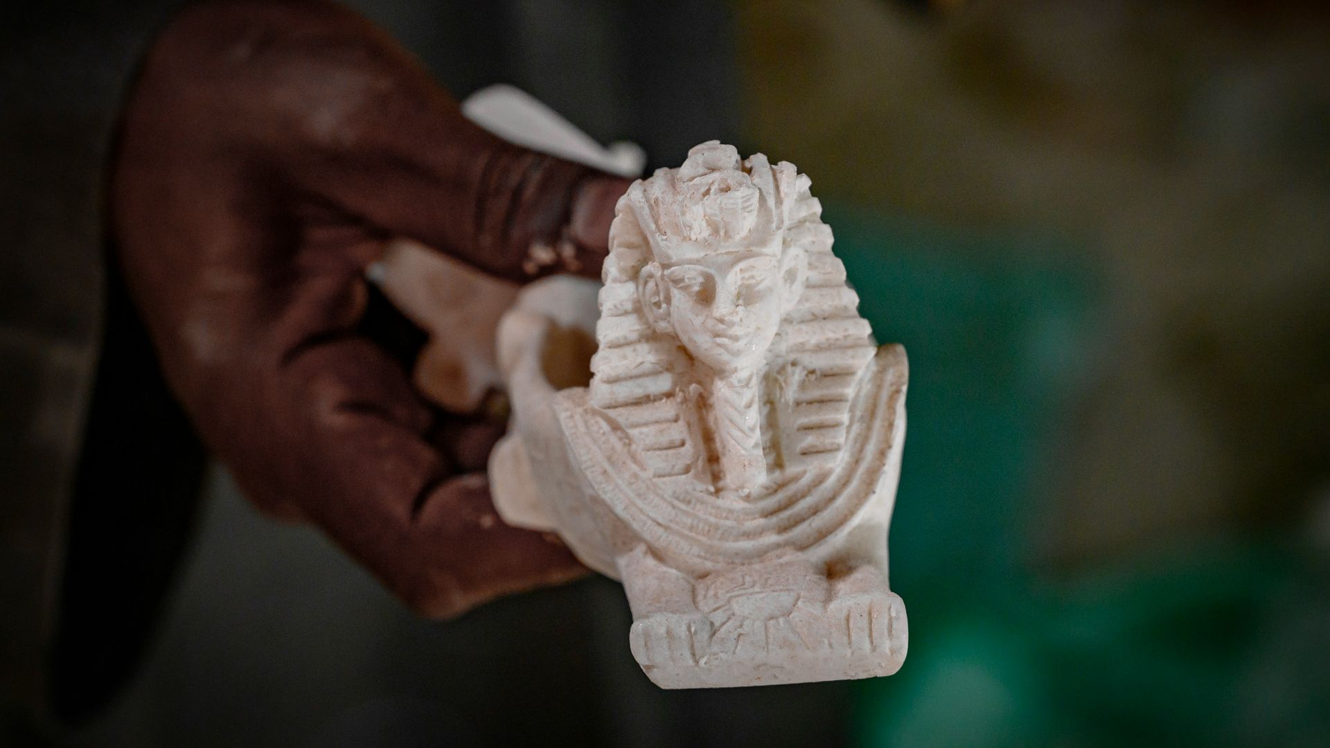 A person holding a white object in their hand