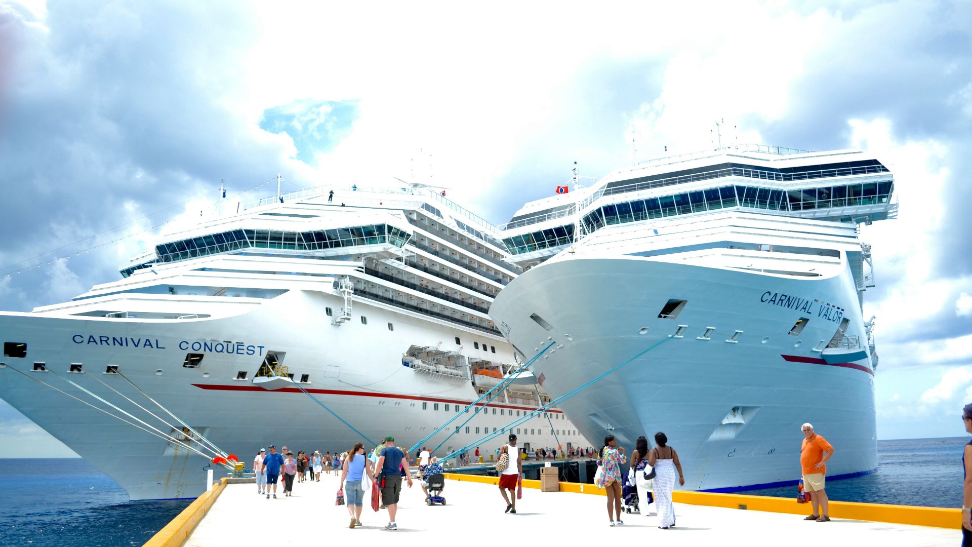 white cruise ship on dock during daytime