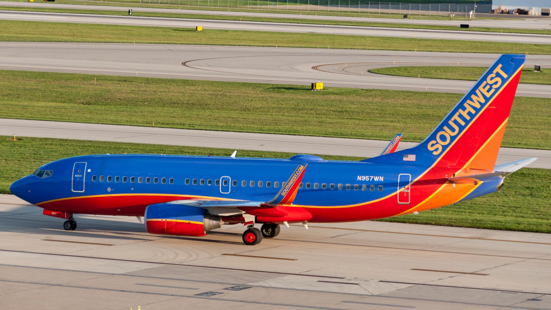 A Southwest Boeing 737-700 with the Tail number N957WN, preparing to take off on an August evening from KCMH.