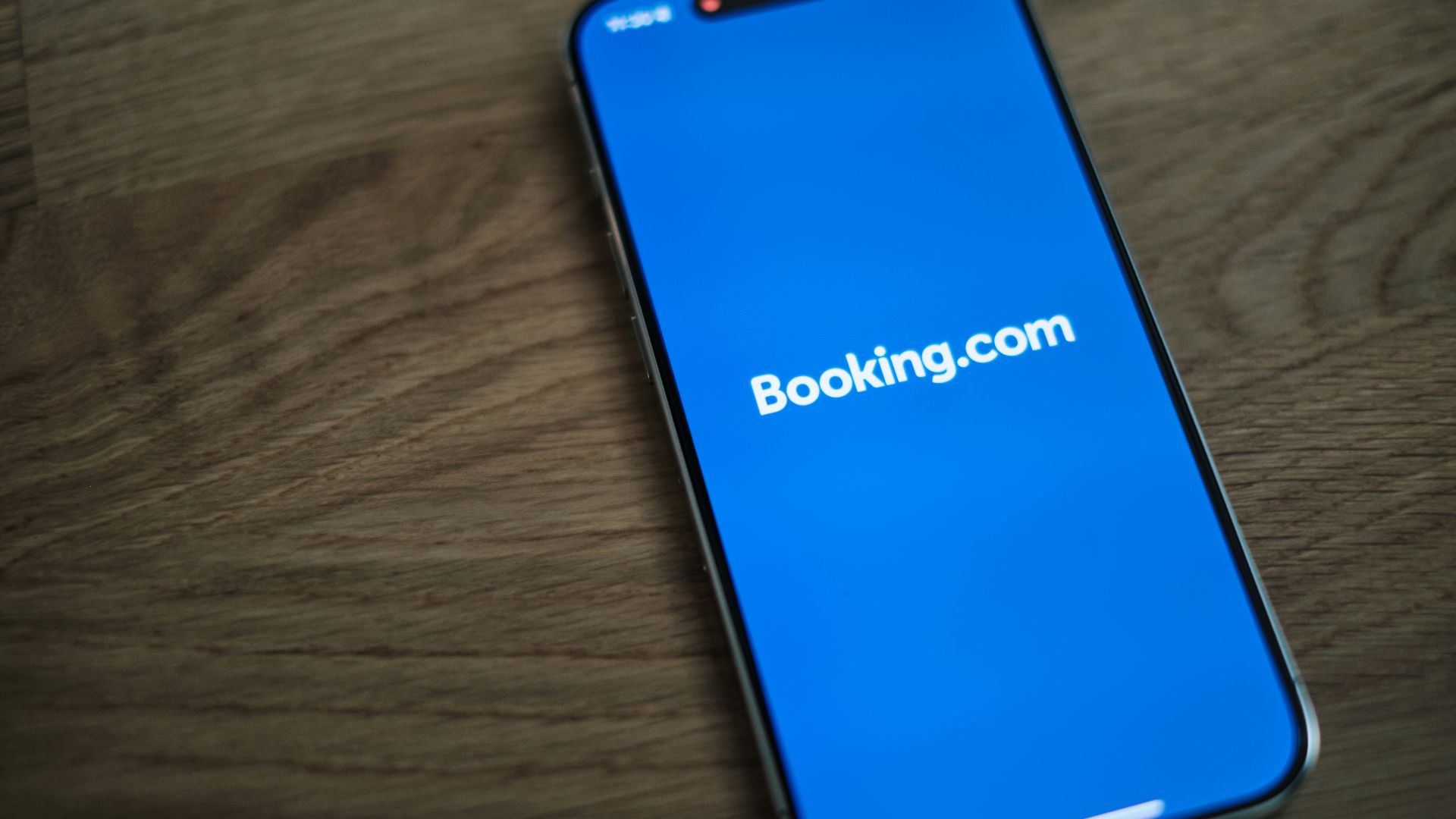 A blue samsung phone with the logo of bookking com on it