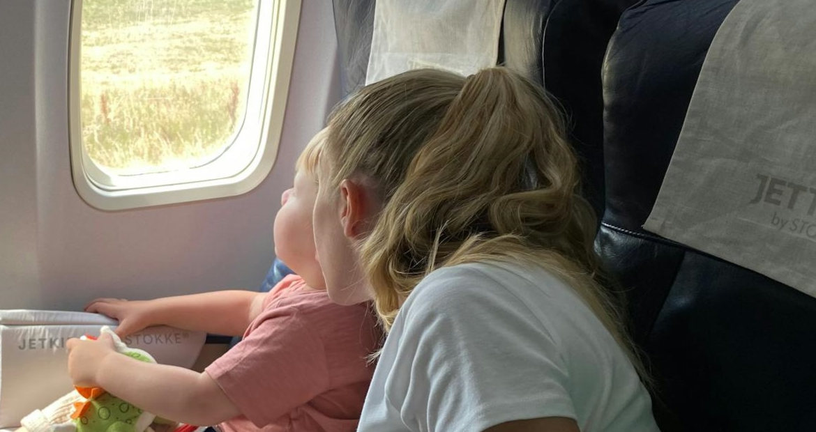 Woman and kid in plane.