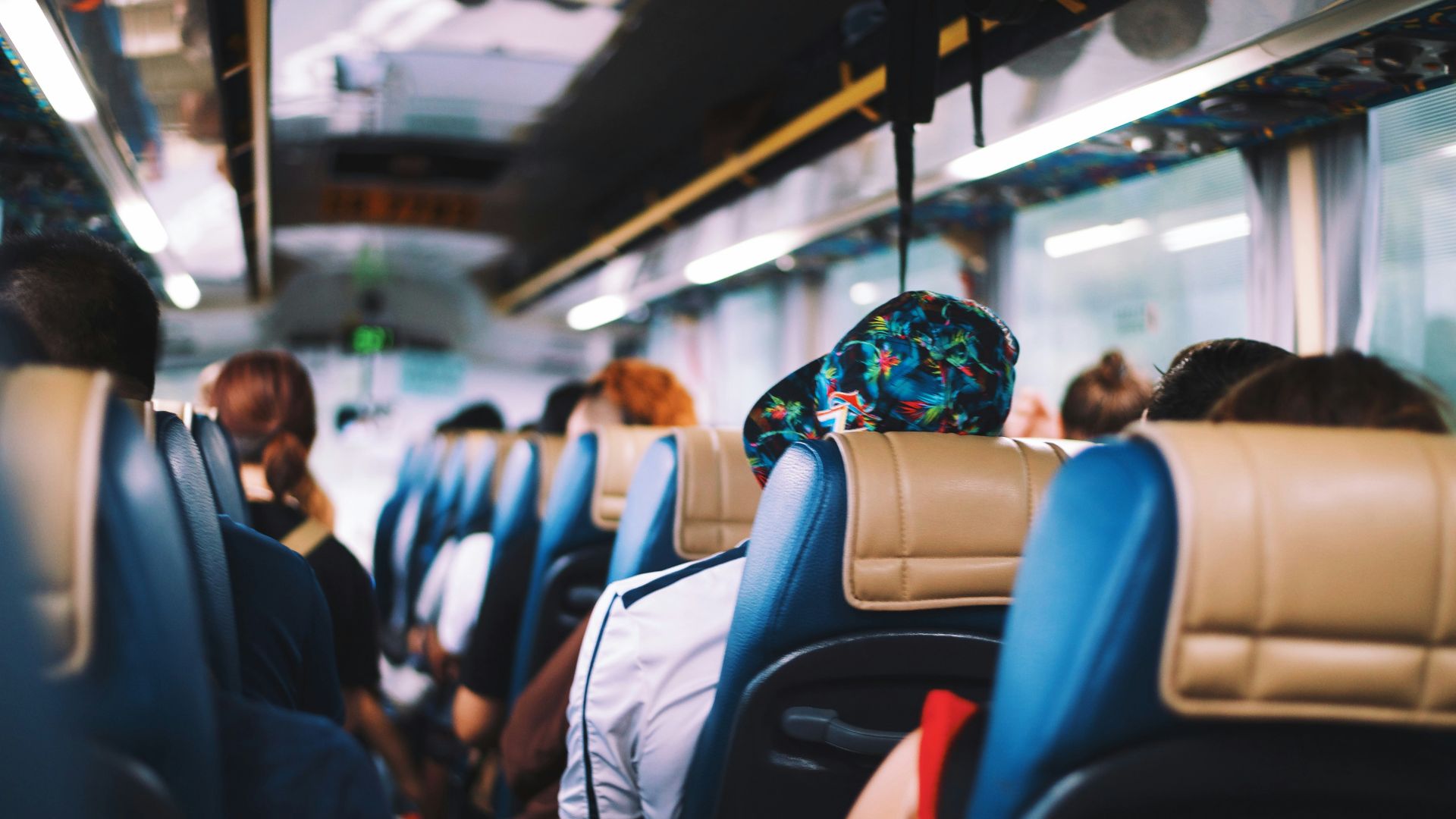 selective focus photography of people on bus