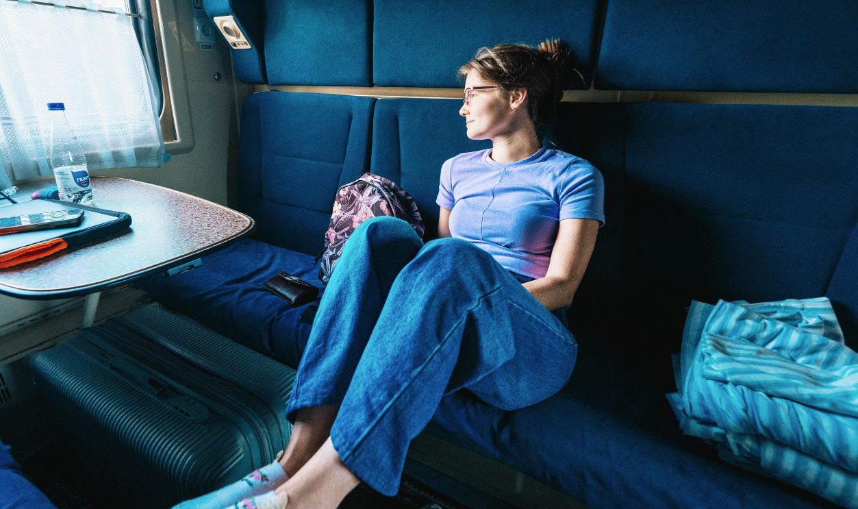 Woman in casual attire enjoying a peaceful train ride