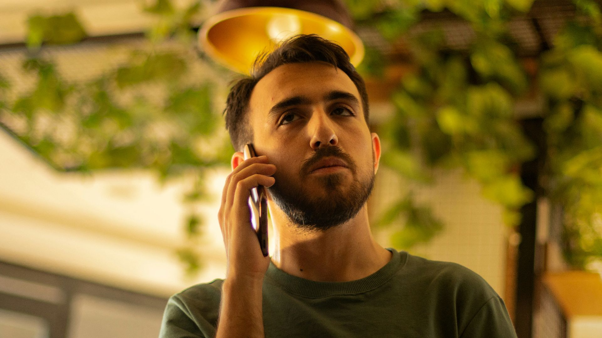 A man is talking on his cell phone