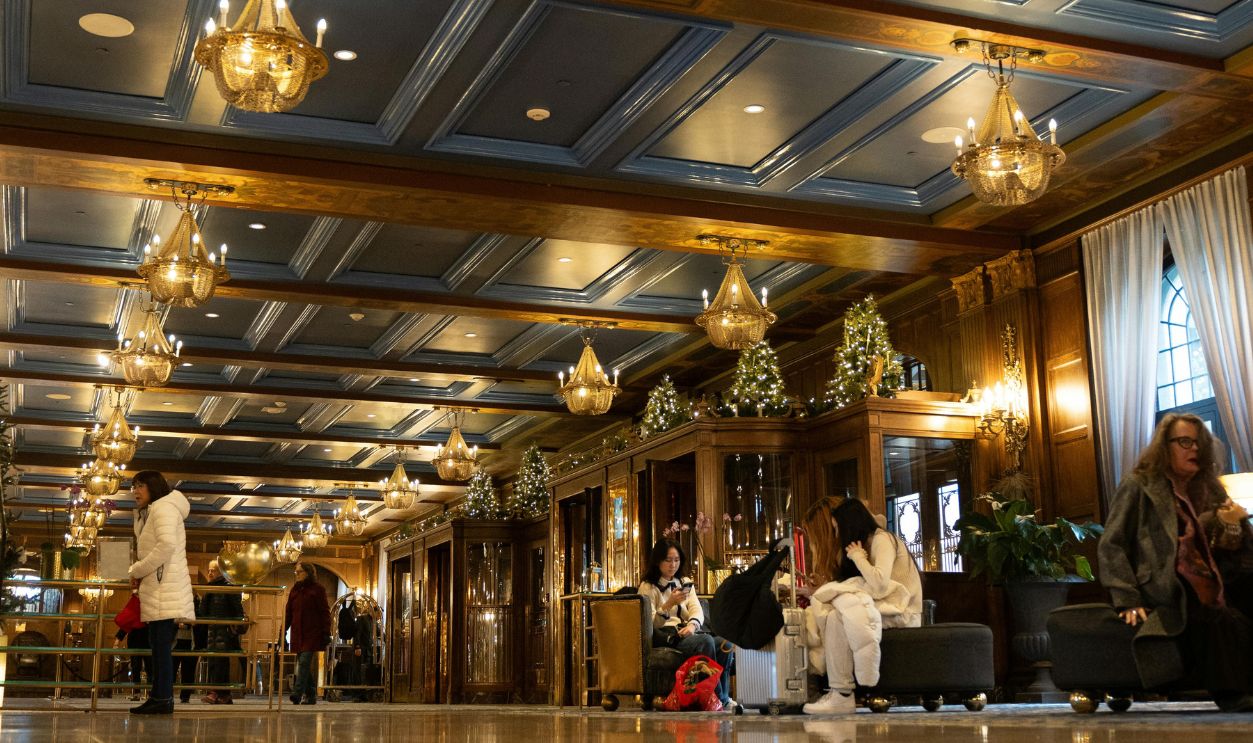 A lavish hotel lobby in Quebec with opulent chandeliers and polished interiors