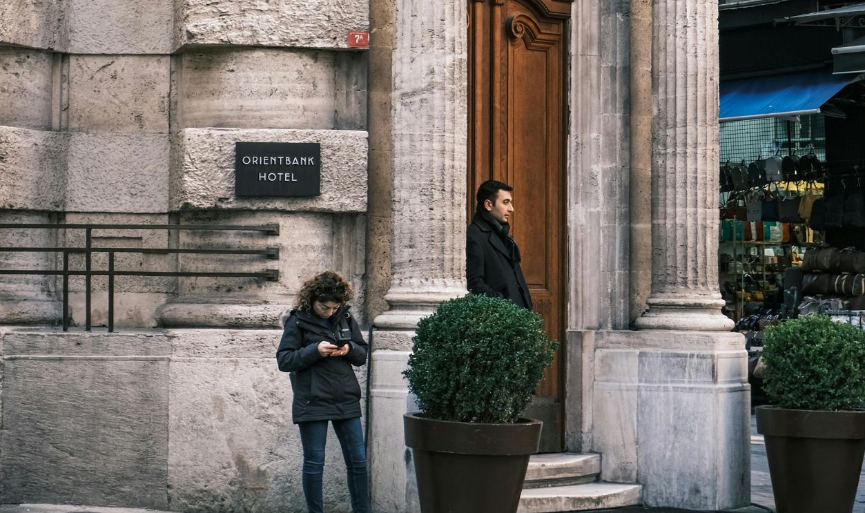 Classic architecture on display in bustling Istanbul streets with people nearby