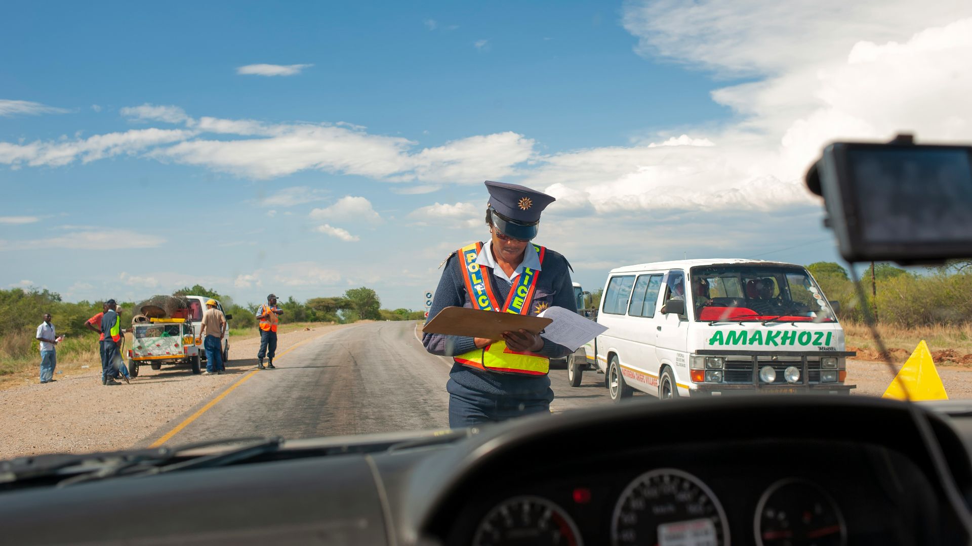 a police officer standing in the middle of the road