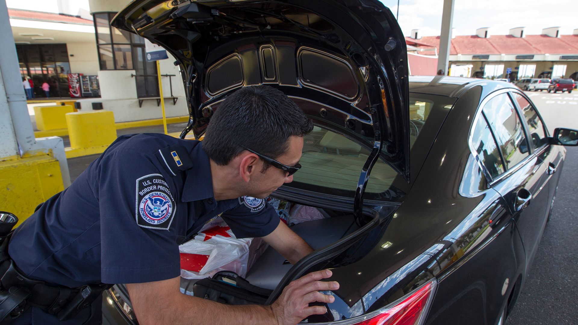 South Texas CBP officer inspects inbound vehicles at the Juarez Lincoln Bridge port of entry in Laredo Texas.

Photographer: Donna Burton