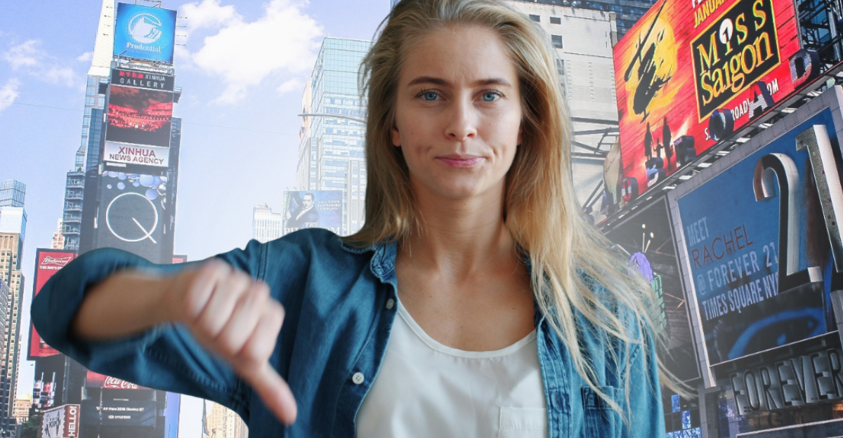 young-woman-showing-thumbs-down-gesture