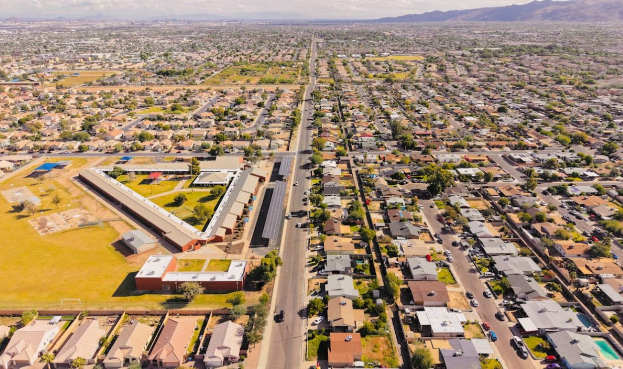 Aerial view of a sprawling residential area in Arizona under a bright day sky