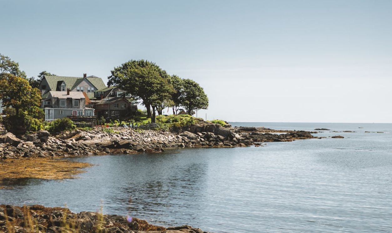 Charming coastal houses by rocky shore in Portland, Maine