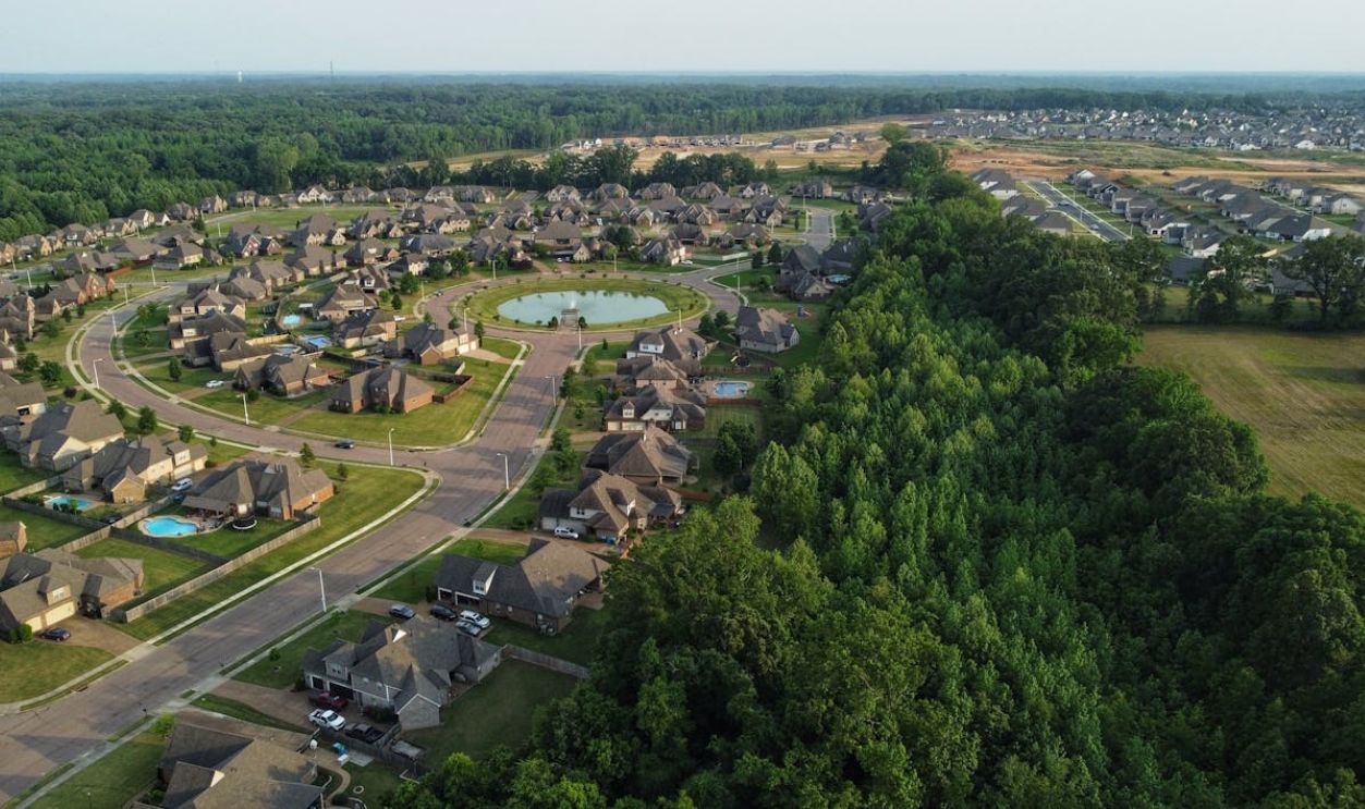 Aerial view showcasing a suburban neighborhood in Memphis, TN with houses and trees