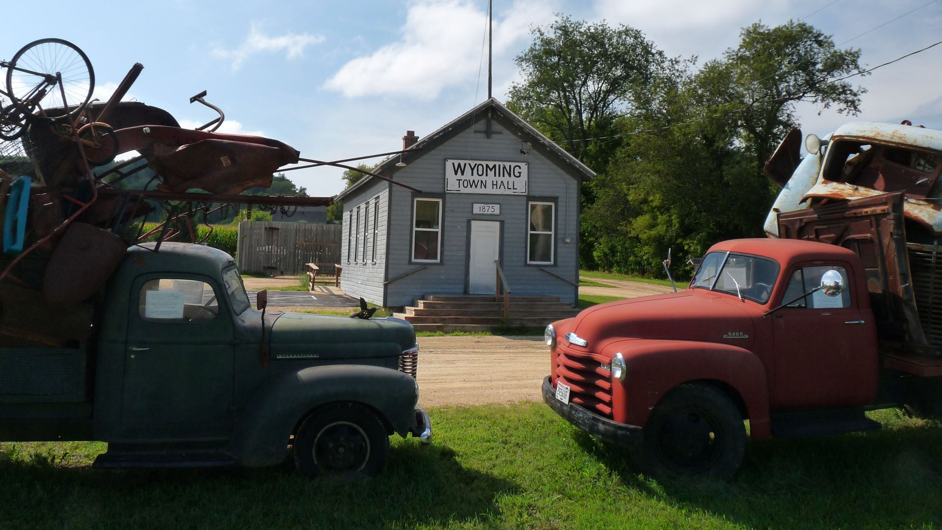 Today's town hall in the Town of Wyoming in Iowa County, Wisconsin was built as a one-room school in 1875.  The assemblages in the foreground are art.
