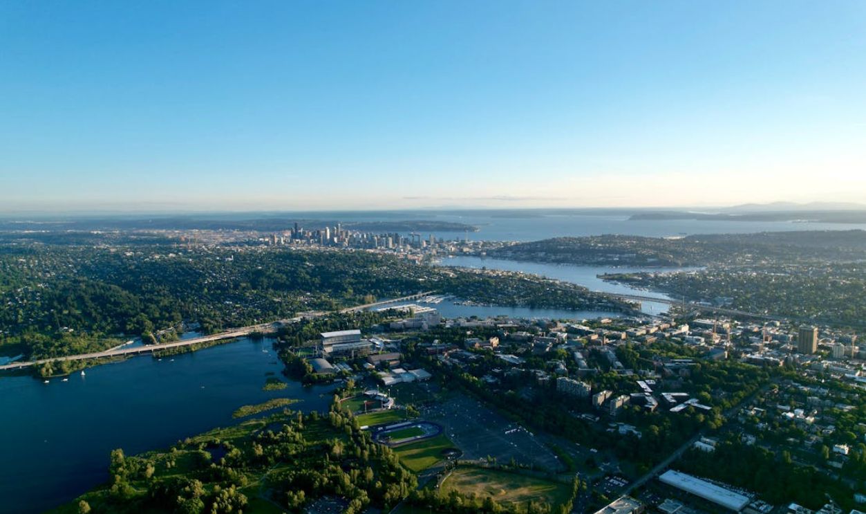 Stunning aerial view of Seattle's skyline and Lake Washington under a clear blue sky