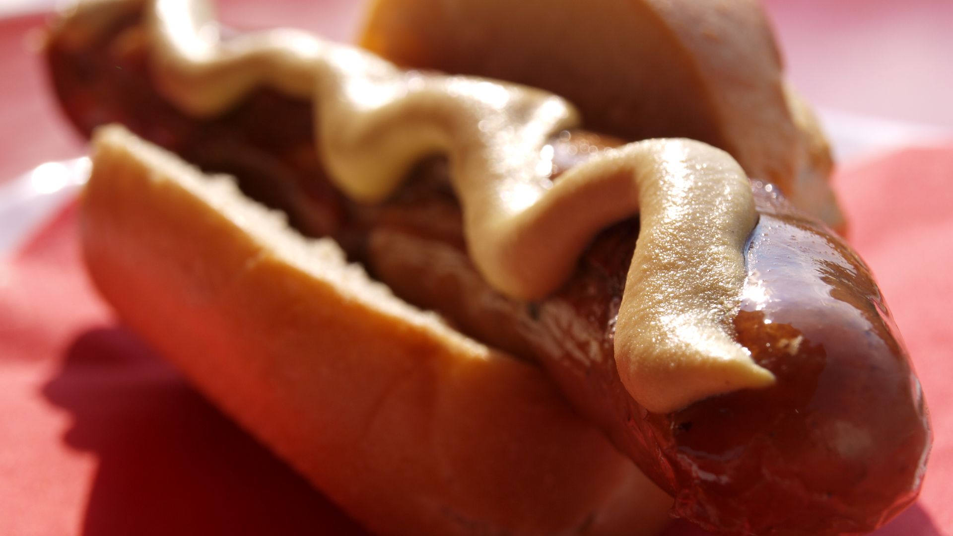 German 'Bratwurst' in a bun with mustard.