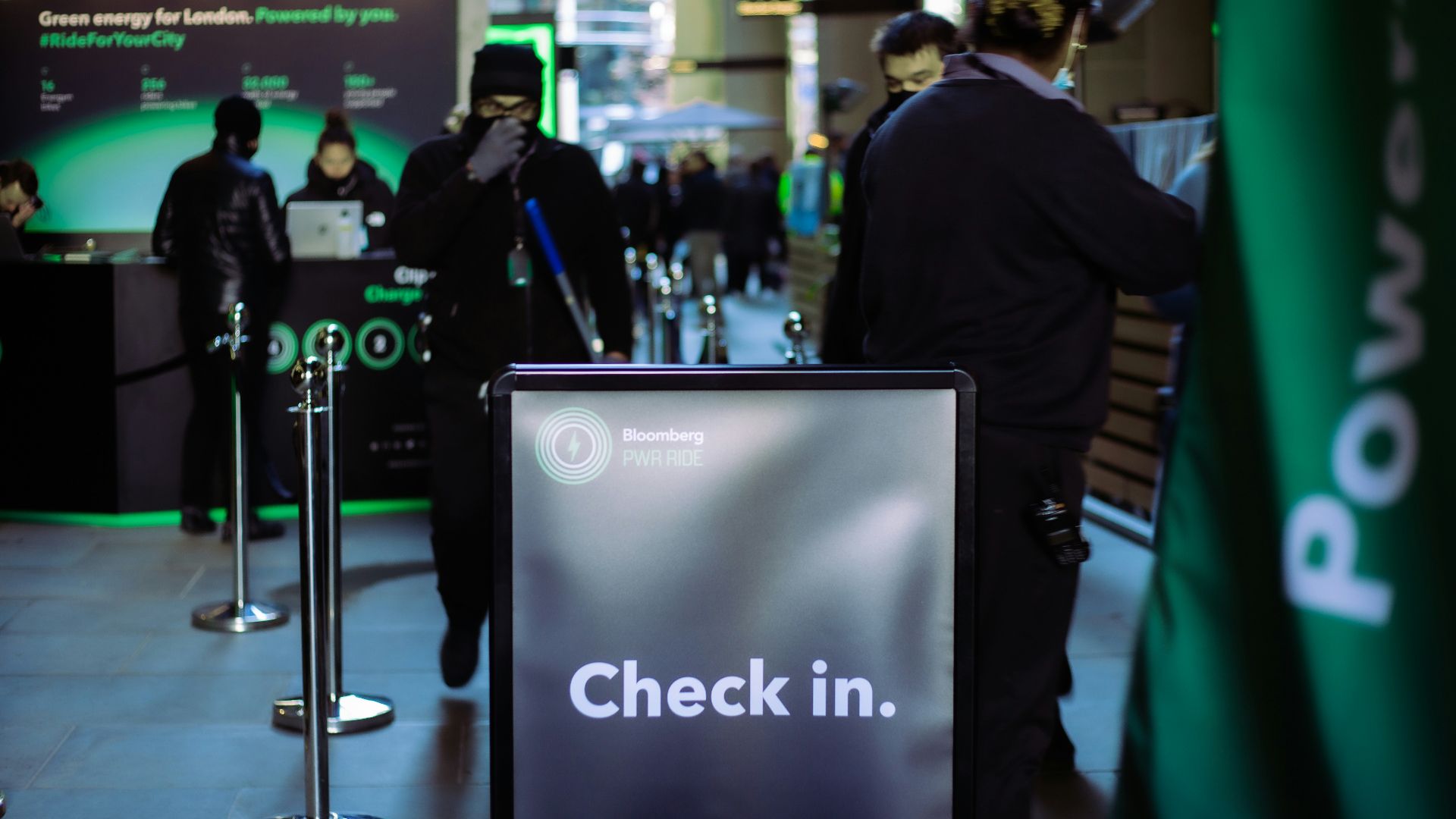 a group of people standing around a check in counter