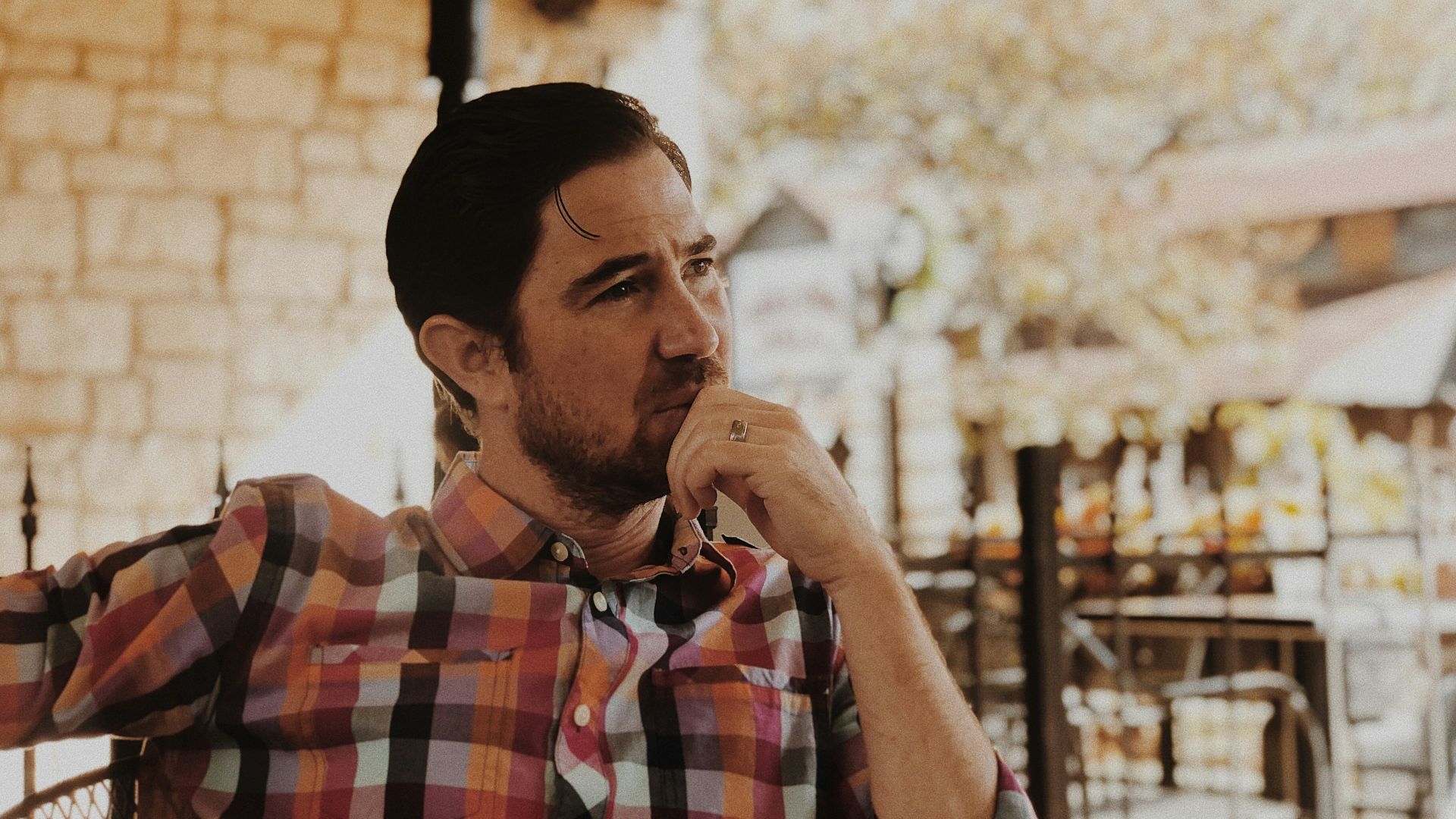 man in red and black plaid dress shirt