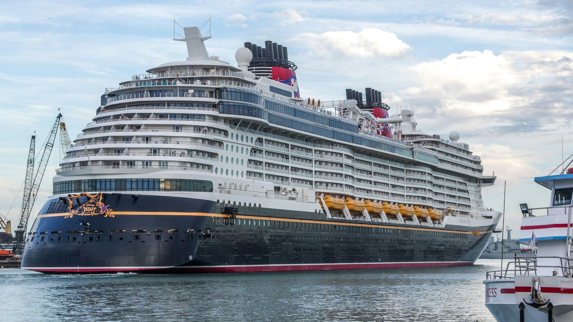 a large cruise ship docked at a dock