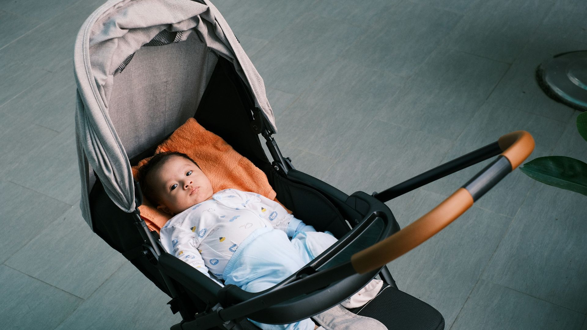 a baby is sleeping in a stroller