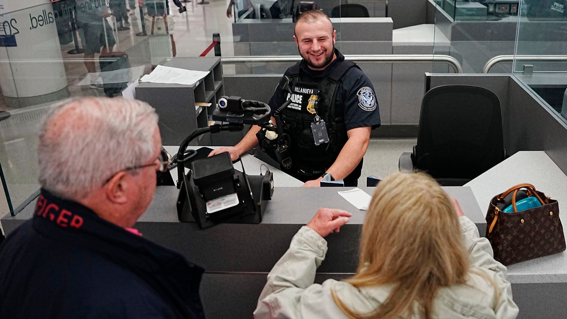 A U.S. Customs and Border Protection officer processes travelers arriving on international flights at Baltimore/Washington International Thurgood Marshall Airport February 27, 2025. CBP Photo by Glenn Fawcett