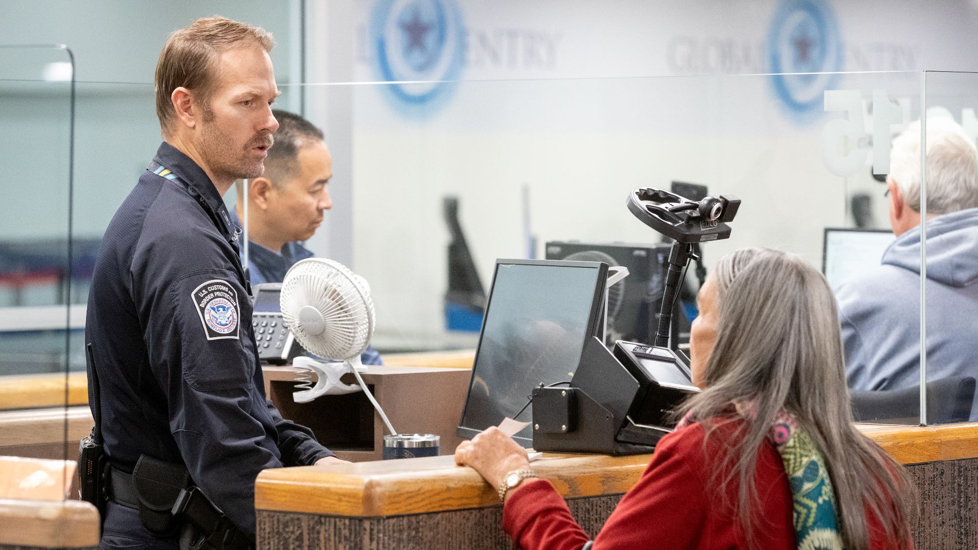 A U.S. Customs and Border Protection officer processes arriving international passengers at Phoenix Sky Harbor International Airport in Phoenix, Ariz., December 11, 2024. CBP Photo by Jerry Glaser