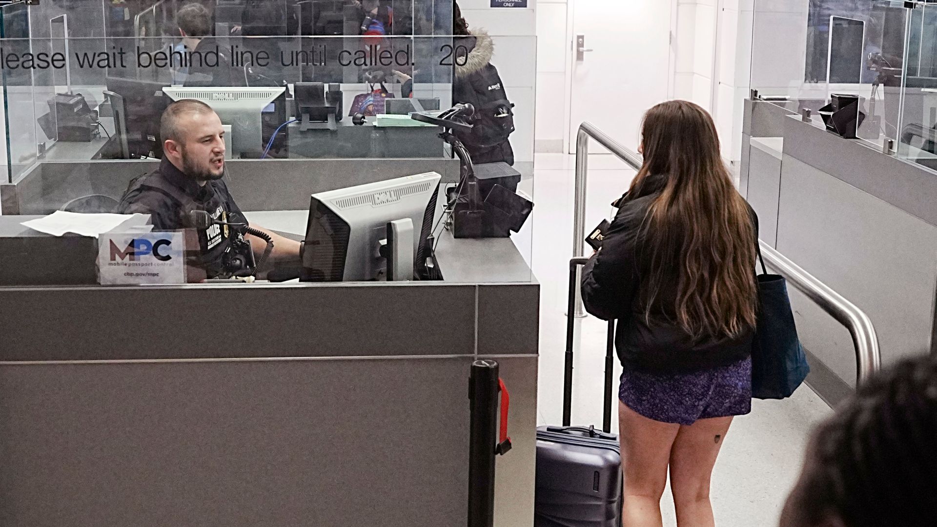 A U.S. Customs and Border Protection officer processes travelers arriving on international flights at Baltimore/Washington International Thurgood Marshall Airport February 27, 2025. CBP Photo by Glenn Fawcett