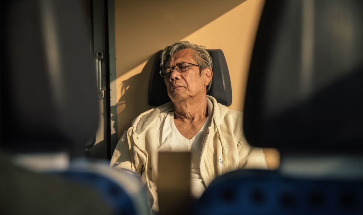 man sitting on leather vehicle seat