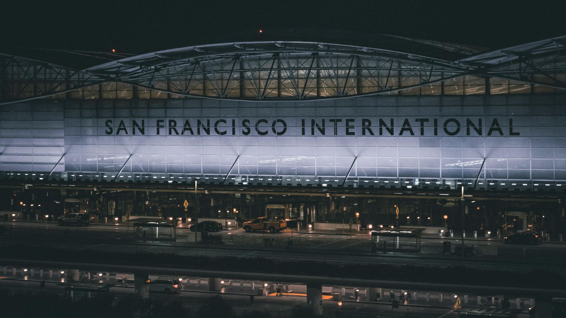 Dramatic nighttime view of the illuminated facade at San Francisco International Airport.