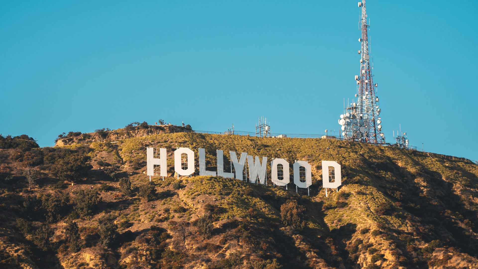 Iconic Hollywood Sign on a sunny day in Los Angeles, California.