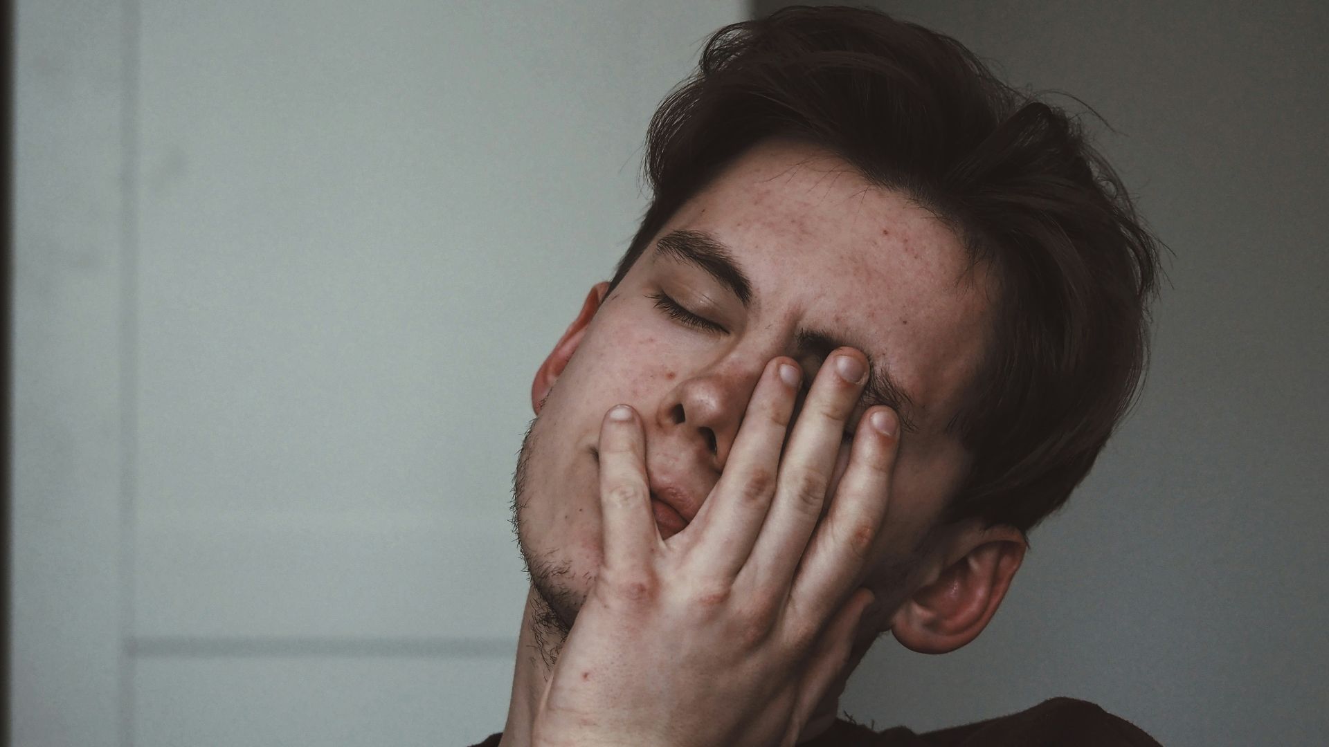 man wearing black crew-neck top