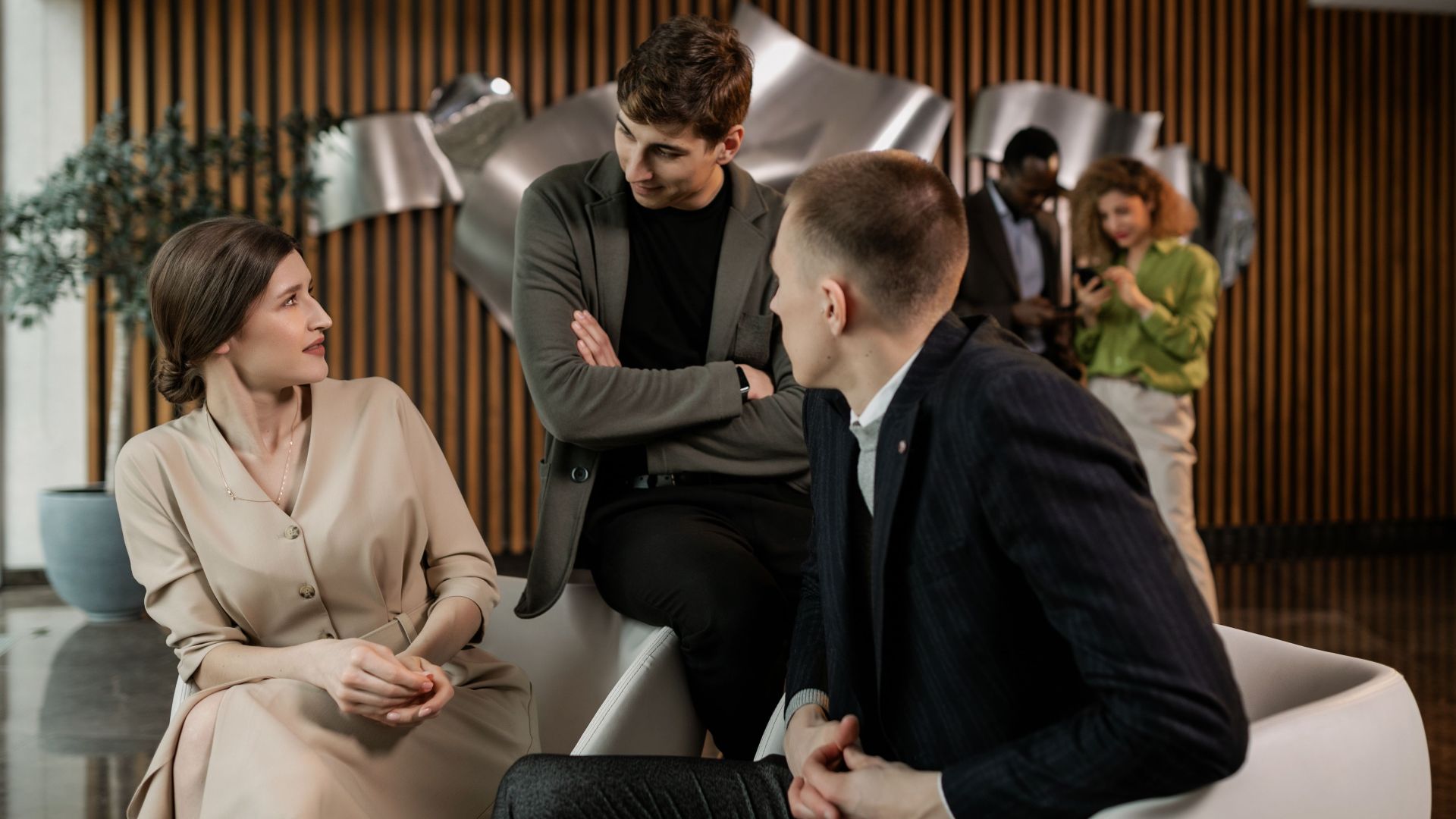 Group of professionals having a collaborative meeting in a modern office setting.