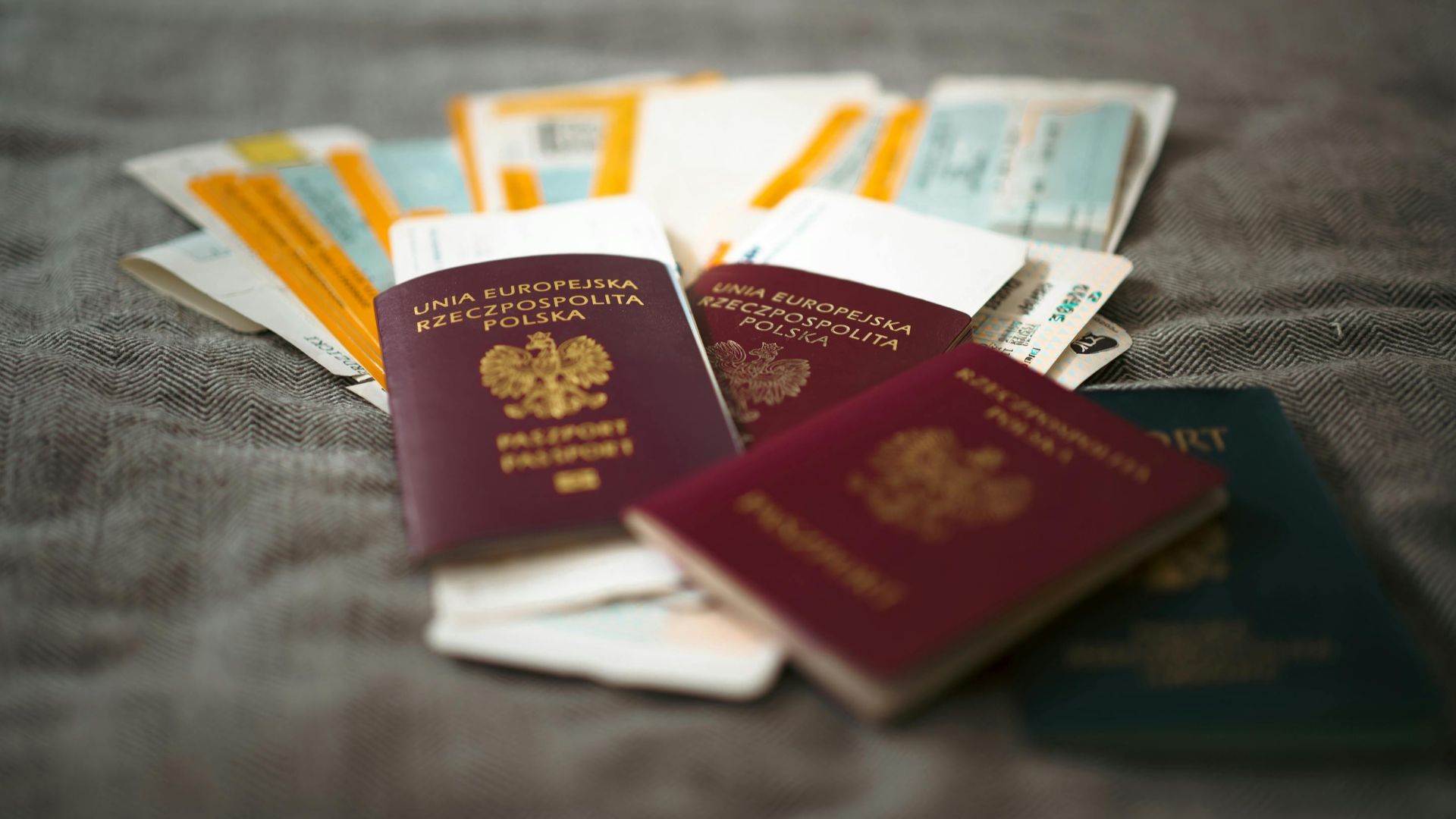Close-up of Polish passports and travel tickets symbolizing travel and adventure.