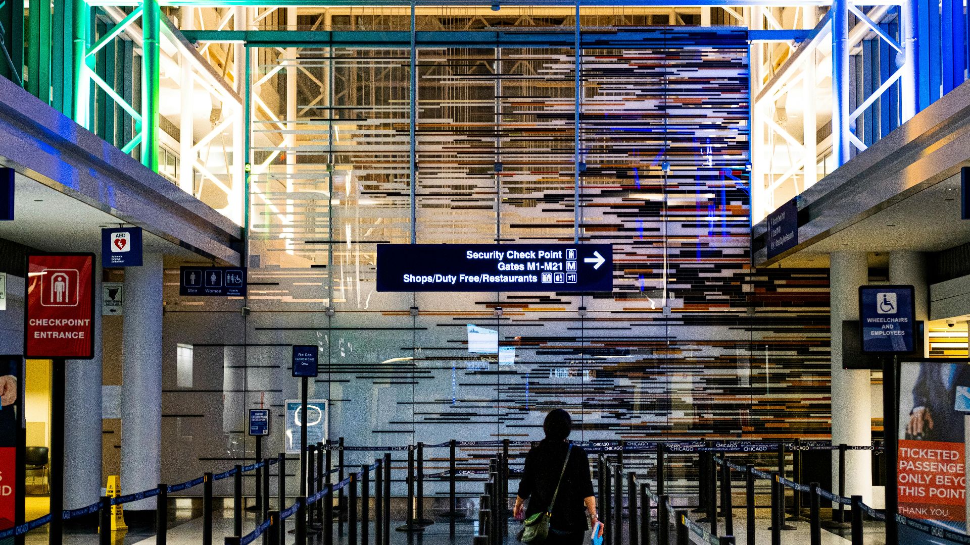A traveler enters the security checkpoint at O'Hare Airport terminal, Chicago.