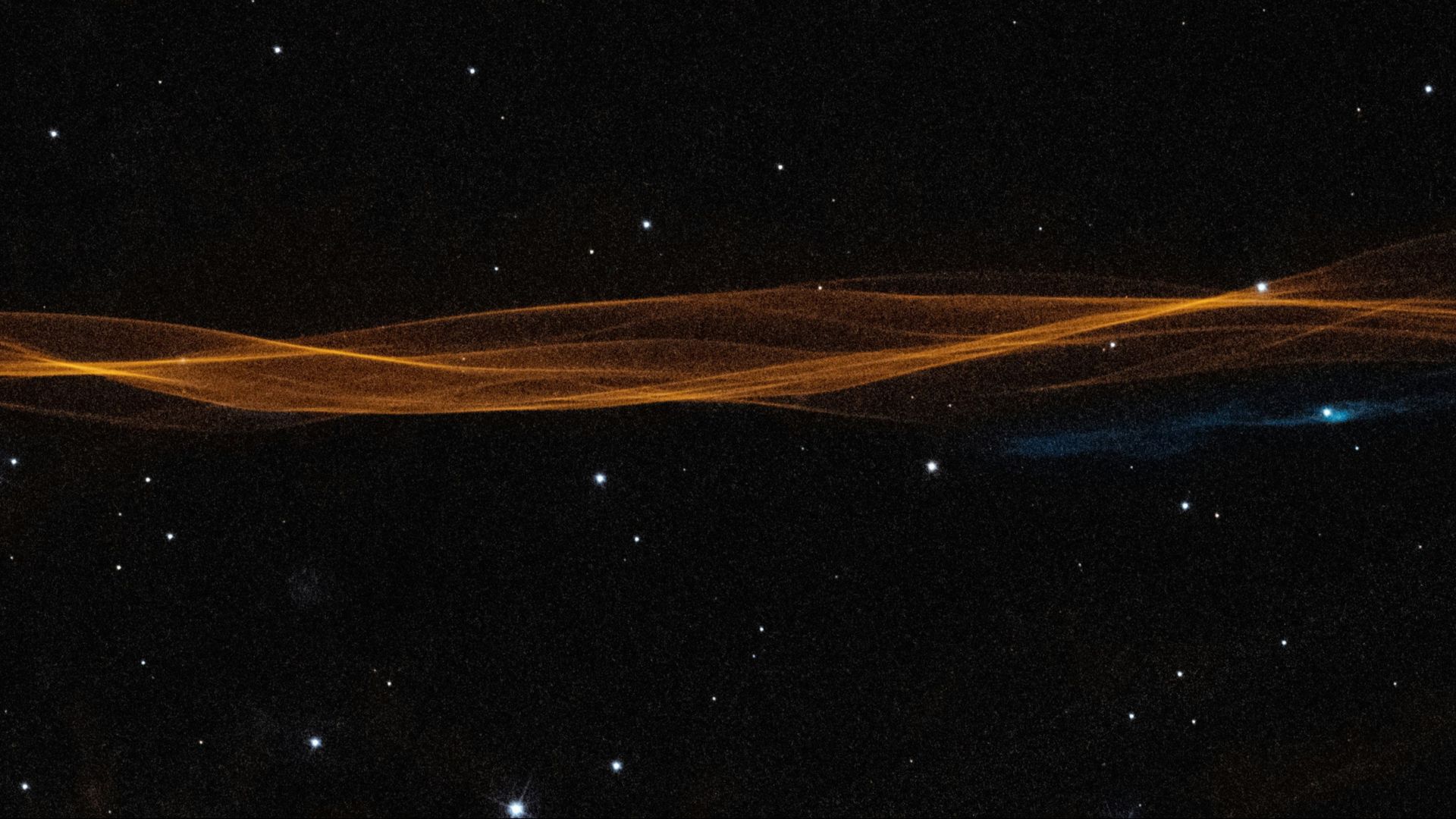a dark sky with stars and lines of light