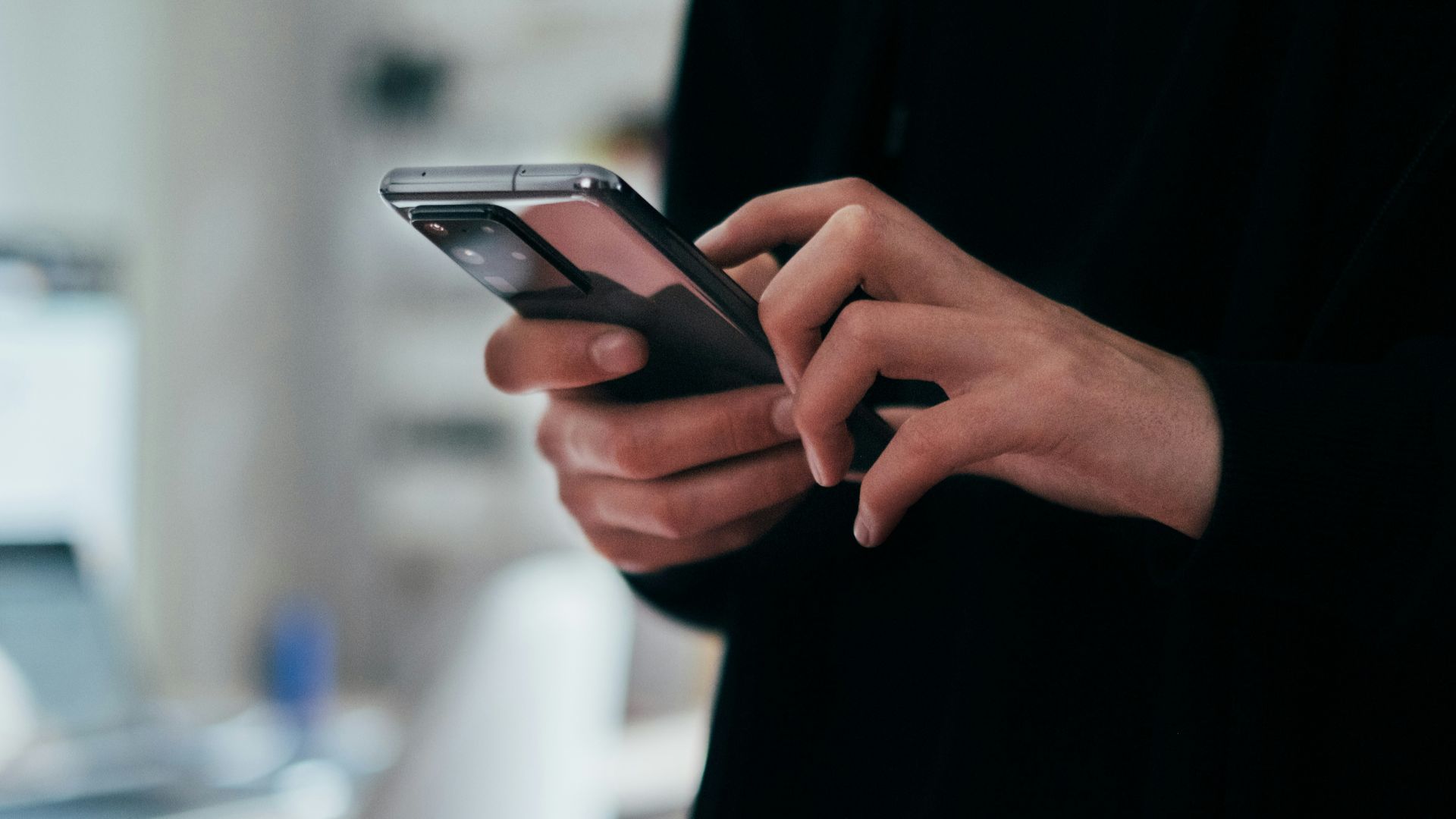 person holding black android smartphone