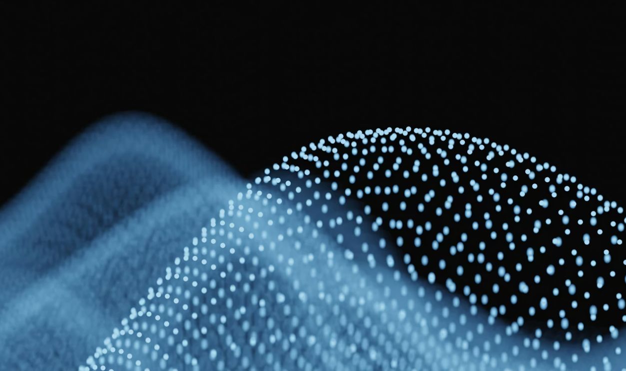 Abstract blue waves of glowing particles