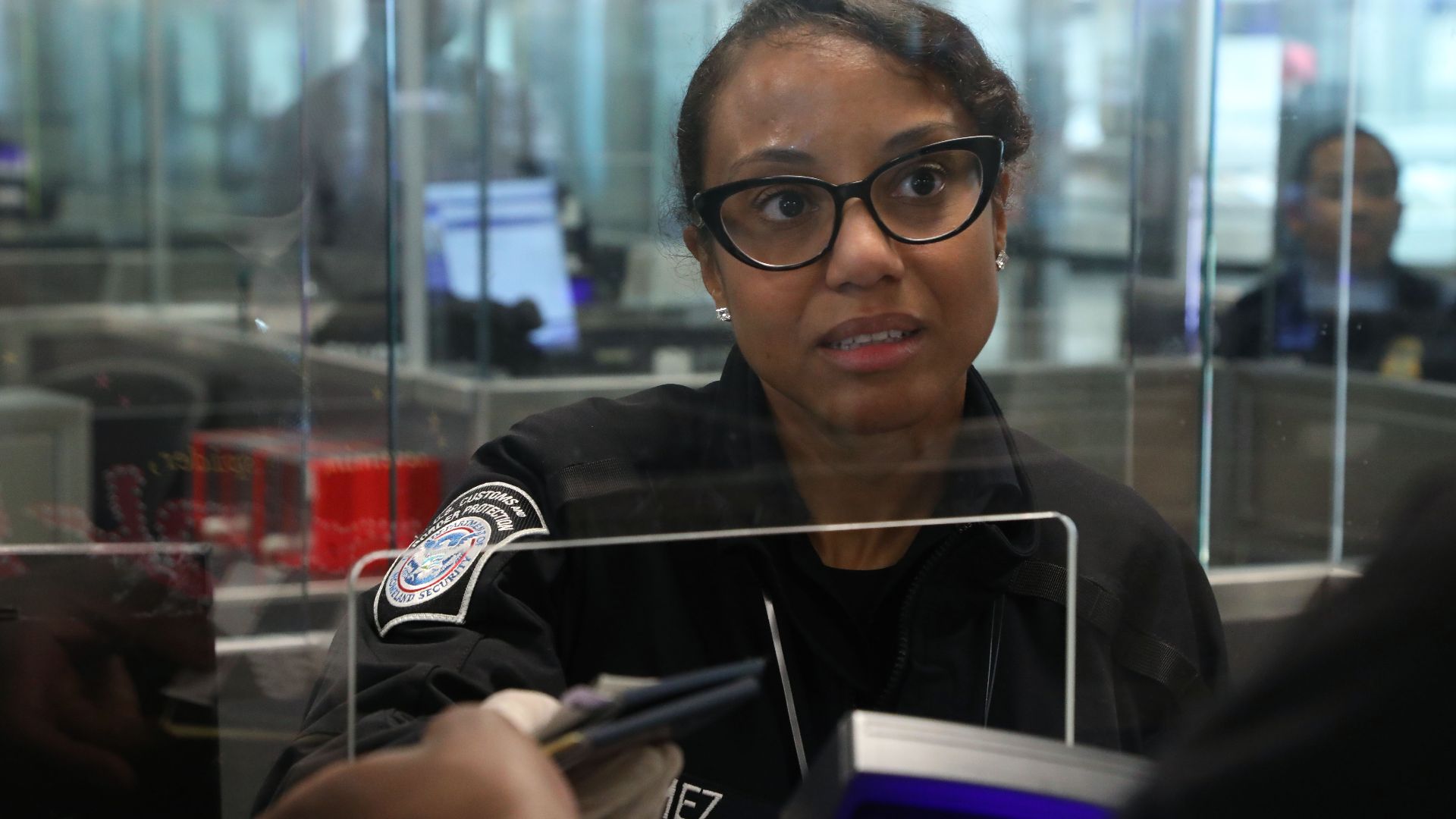 A U.S. Customs and Border Protection officer processes arriving passengers at Dulles International Airport in Sterling, Va., April 29, 2024. CBP Photo by George Felton