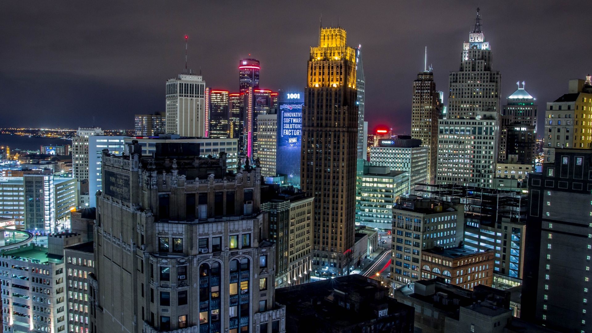 Night-time skyline shot of glowing city that is Detroit.
