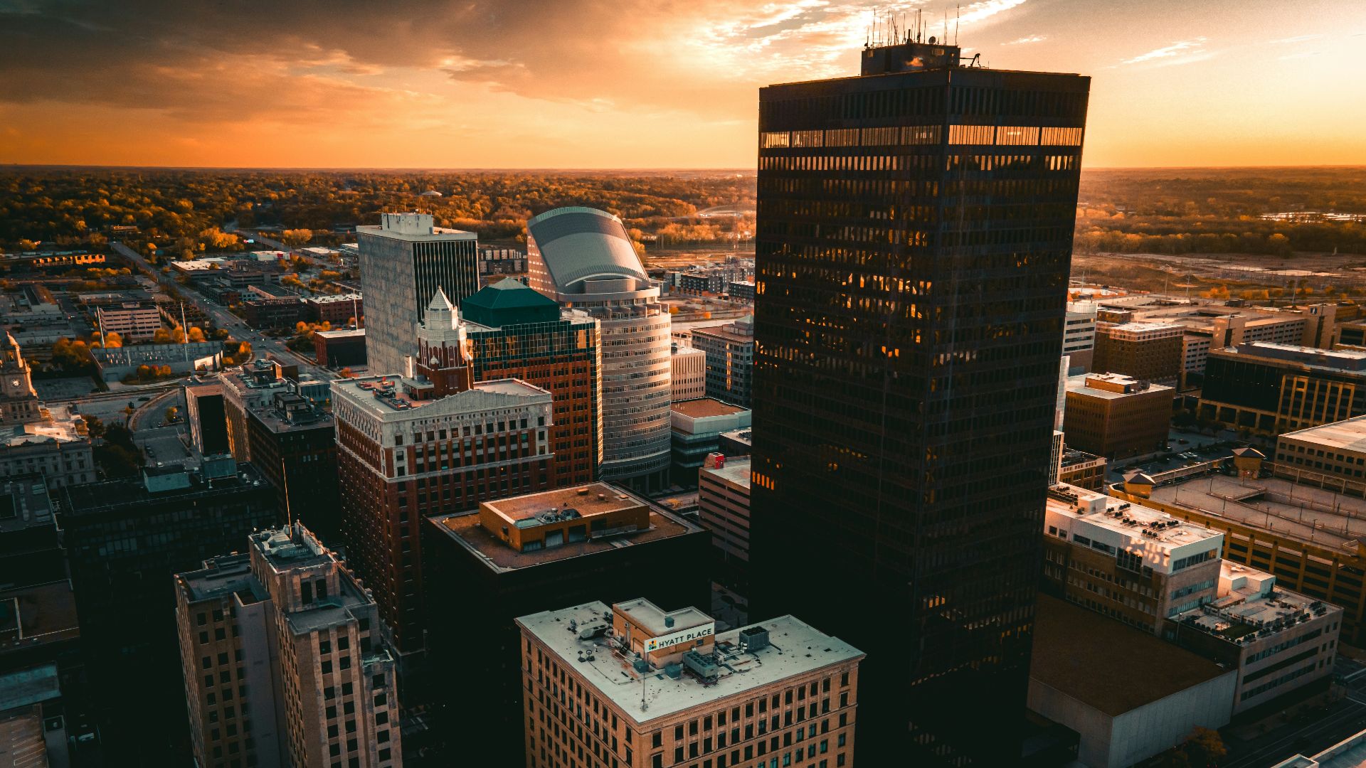an aerial view of a city at sunset