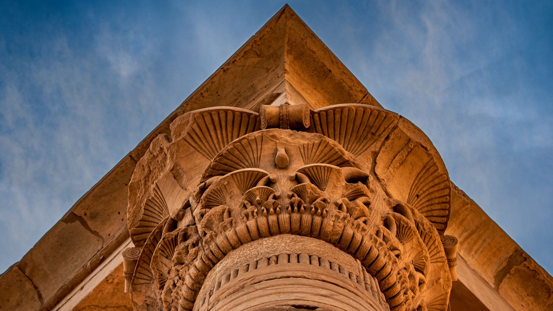 This picture was taken of a triangular part of the pillars of the Temple of Philae in Aswan, and the picture shows the beauty of the architectural details of the temple